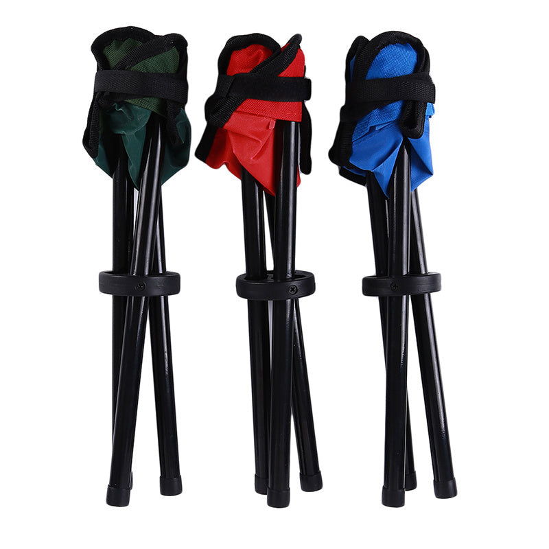 Folded tripod stools in blue, red, and green on a white background.