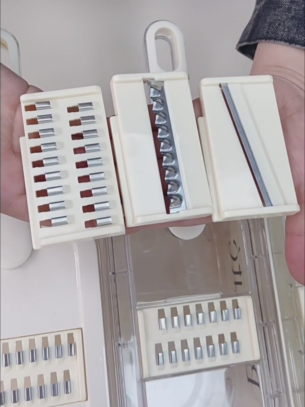Person demonstrating functions of vegetable cutter slicing and chopping various vegetables in a kitchen